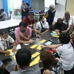 BRAINSTORMING The workshop participants as they exchange ideas in the drafting of POPS Plan which is being readied for implementation in the next three years.