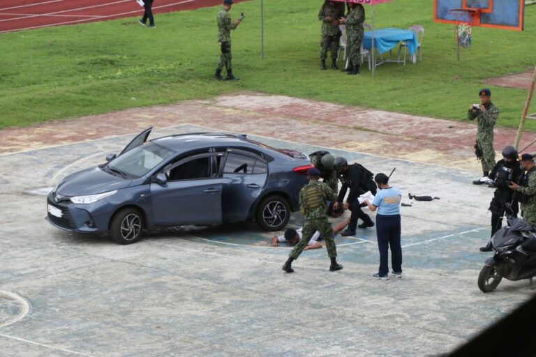 DRILL. The operatives of the NCPO’s Mobile Force Company during the conduct of one of its simulation activities at the Metro Naga Sports Complex in Barangay Pacol. (REY BAYLON, CEPPIO.)