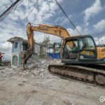 Backhoe demolishing the Barangay Hall of Mabolo