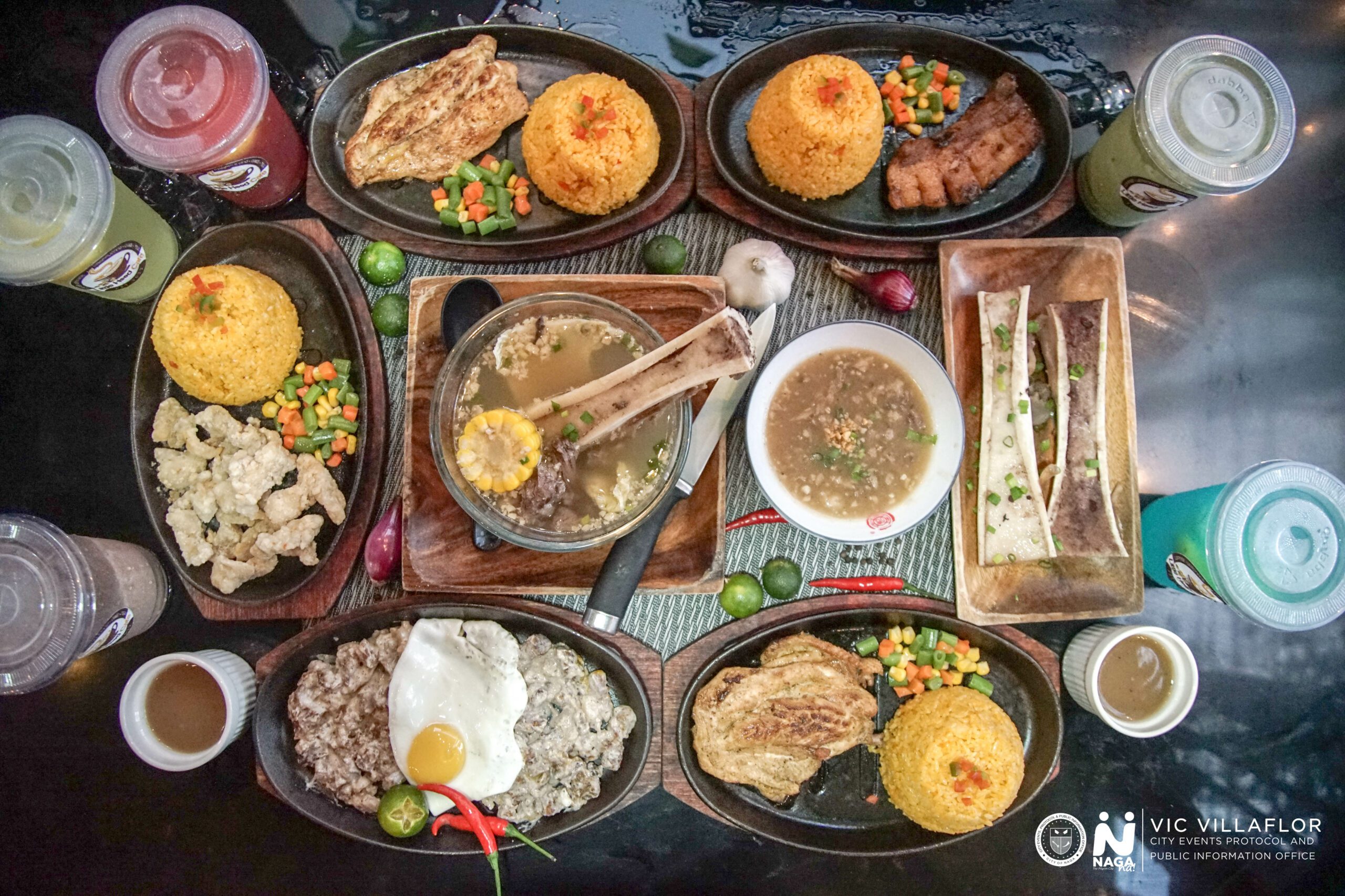 An image featuring JCJ Food Hub's assortment of food spread out onto a table.