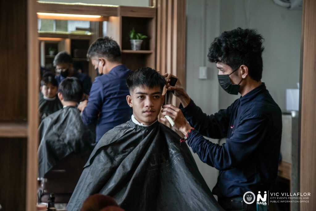 An image of a man getting his hair cut.