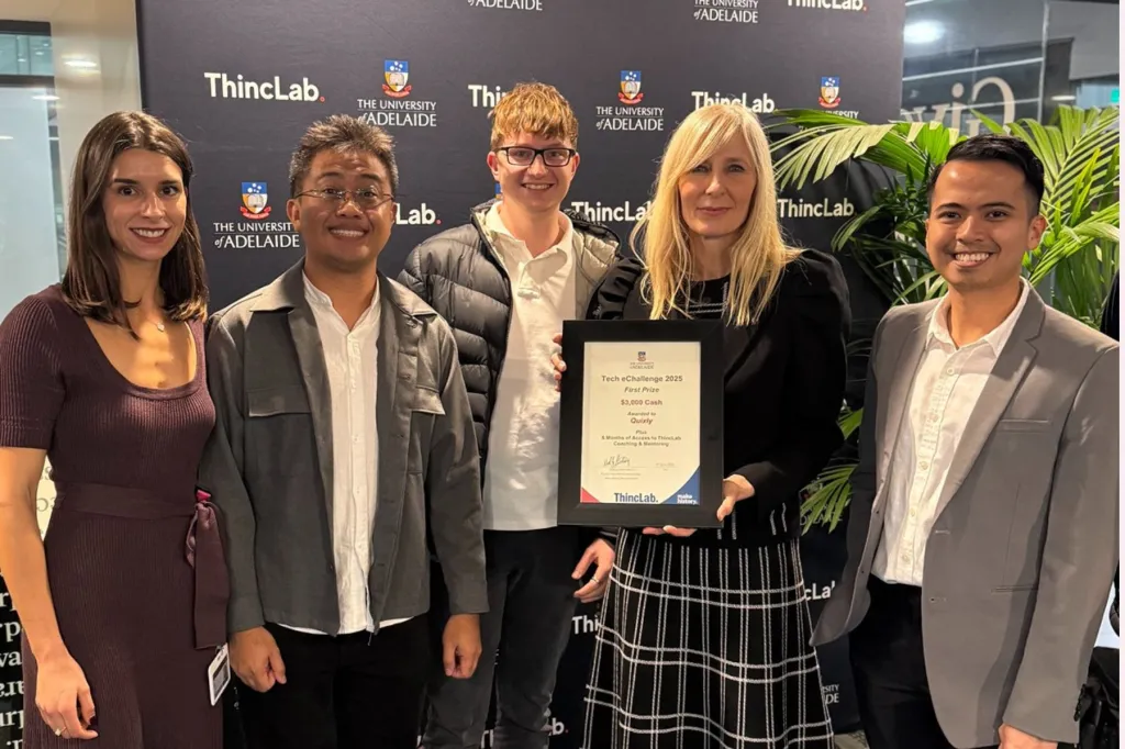 PJ Legaspi (right) celebrates with his team and ThincLab members after winning first place in the University of Adelaide’s Tech eChallenge this year.